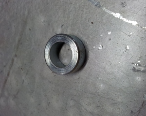 Bushing reinforcement nozzle for swine feeder